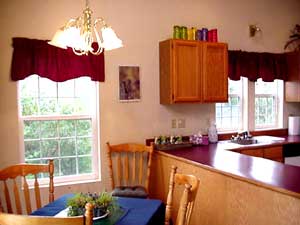 Looking across the table twoard the kitchen