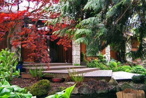 Broad wood steps lead to the entryway