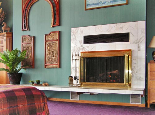 The master bedroom's fireplace is perhaps the most inviting in the home