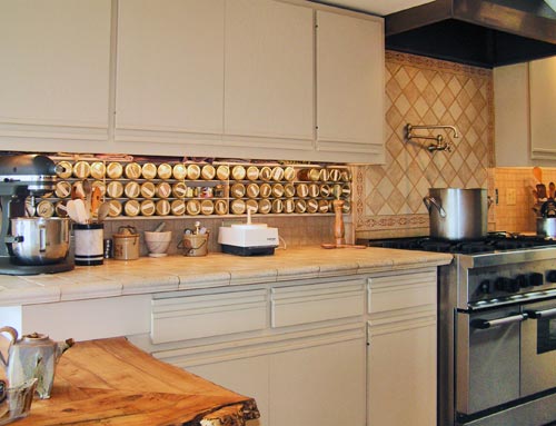 Custom hood and stove, with custom live-edge maple countertops in the foreground