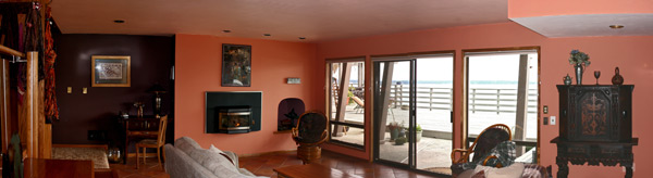 The downstairs living room opens directly onto the expansive deck