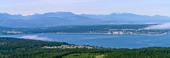 Aerial view over Discovery Bay to the Olympic Mountains